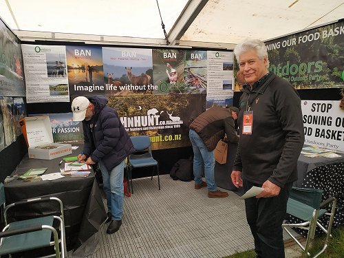 Alan Simmons on Outdoors Party stand and people signing up at the Sika show, Taupo, 2019 